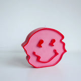 Trippy Smiley Face Candle Pink